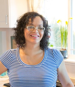 Kelly Bejelly wearing a striped shirt in her kitchen